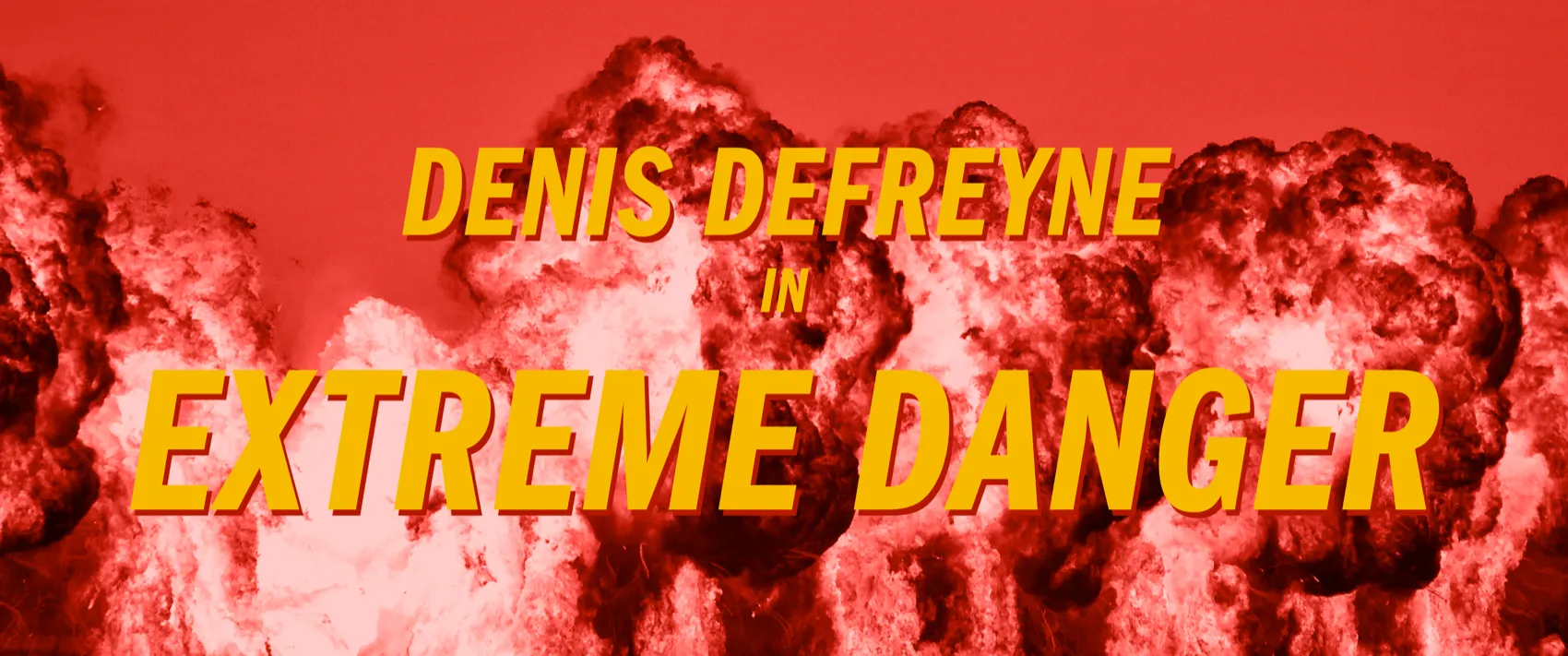 A movie title screen with fiery explosions and the superimposed text “Denis Defreyne in Extreme Danger.“
